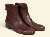 brown leather ankle boots on a white background