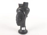 an image of a statue of a woman with a hat on her head