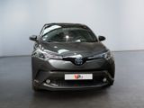 the toyota c - hr is parked in the showroom