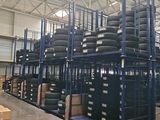 a large warehouse filled with lots of tires and boxes