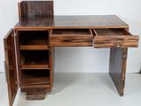 a wooden desk with a drawer on top of it
