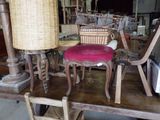 many chairs and a table with a basket on top of it