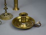 a lot of brass objects that are on the table