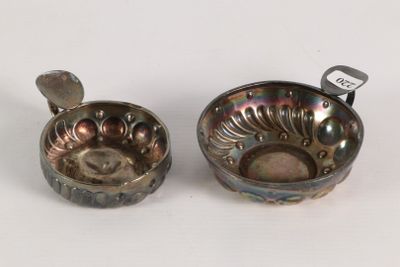 pair of silver plated bowls with spoons on a white surface