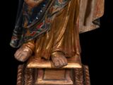 a statue of a woman holding a baby in her arms