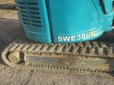 a blue machine that is sitting on the ground