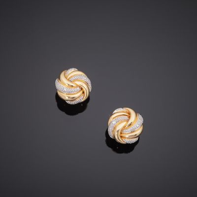 a pair of gold and diamond earrings