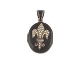 un fer à friser noir et doré orné d'un motif de fleur de lys