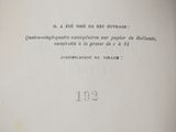 an old book with a black and white picture on it