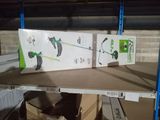 two boxes on a shelf with a green and white cat on it