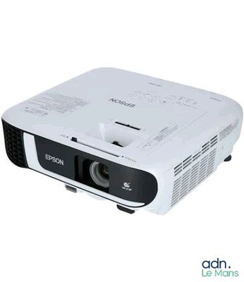 une photo d'un projecteur blanc posé sur une table
