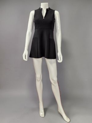 the mannequin is wearing a black dress with a collared neck