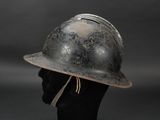 an old helmet on a mannequin head on a black background