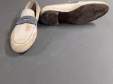 pair of women ' s shoes on a gray surface