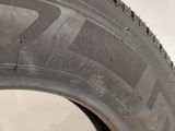a close up of a tire on a white surface