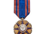 l'image d'une médaille surmontée d'une étoile