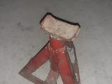 a small red stool sitting in the middle of the floor