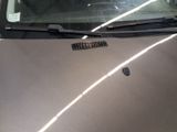 a car that has a sticker on the hood of it