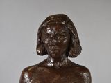 statue of a woman holding a glass of wine in her hand