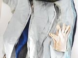 a pile of clothes and gloves sitting on a table