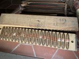 a lot of cigars in a wooden box on the floor