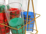 four glasses in a gold holder on a white background