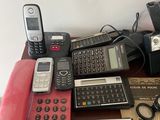 many different types of cell phones sitting on a table