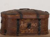 an old suitcase with writing on it sitting on a table