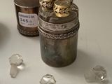 a glass jar with a lot of crystals on the table