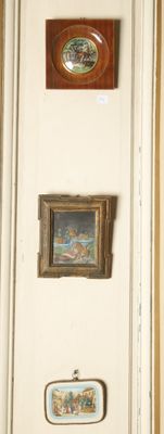 many pictures on the wall above the toilet in the bathroom