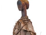 a wooden object with a rope wrapped around it