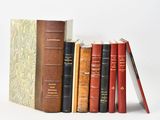 a lot of books that are sitting on a shelf