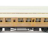two trains that are sitting side by side on a white surface