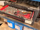 a workbench with many tools in it in a garage