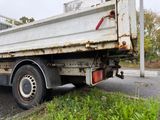 a white truck that is parked on the side of the road