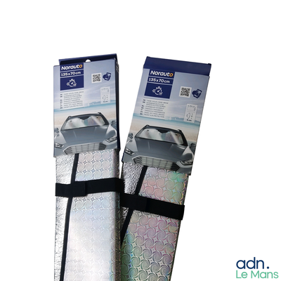 two pieces of luggage that are wrapped in silver foil