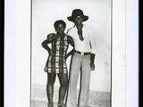 an old black and white photo of two men and a woman