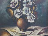 painting of flowers in a vase on a table cloth