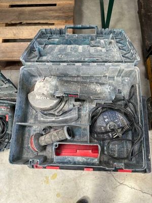 a tool box with tools in it sitting on the floor