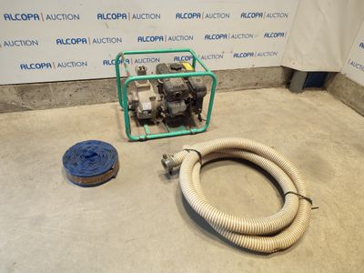 a hose and a hose on the floor next to a wall