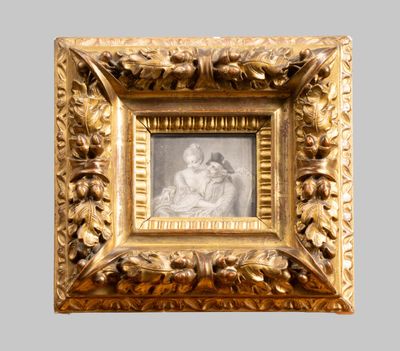 an old picture of a woman and child in a gold frame