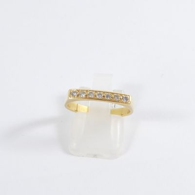 an image of a gold ring with diamonds on it