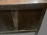 an old wooden cabinet with two doors on it