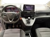 the interior of a car with a steering wheel, dashboard, and dashboard controls