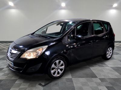 a picture of a black car parked in a garage