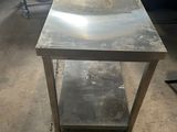 an image of a stainless steel table in a garage