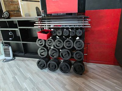 an image of a gym equipment rack with a laptop on top of it