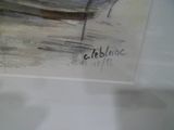 un tableau représentant un bateau, exposé dans une vitrine