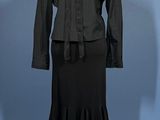 a mannequin with a black dress and a black jacket on it