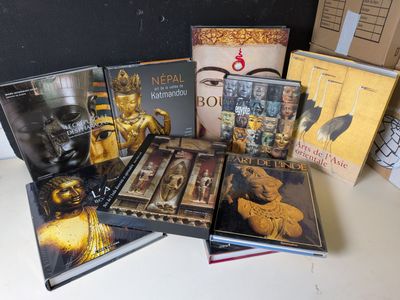 a lot of books that are on a table
